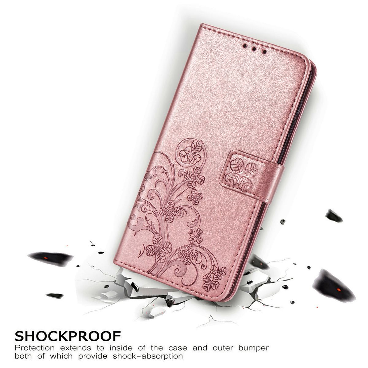 Eine pinkfarbene Handyhülle mit floralem Design, offen, auf einer zerbrochenen Oberfläche.