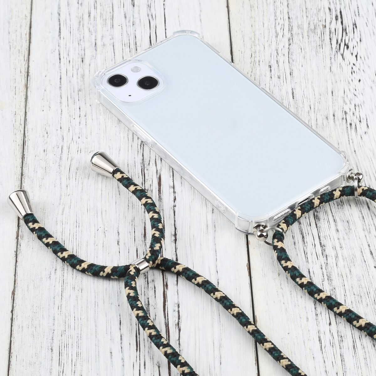 Telefon mit durchsichtiger Hülle und schwarzem und grünem Schlüsselband. Das Telefon liegt auf einer weißen Holzoberfläche.