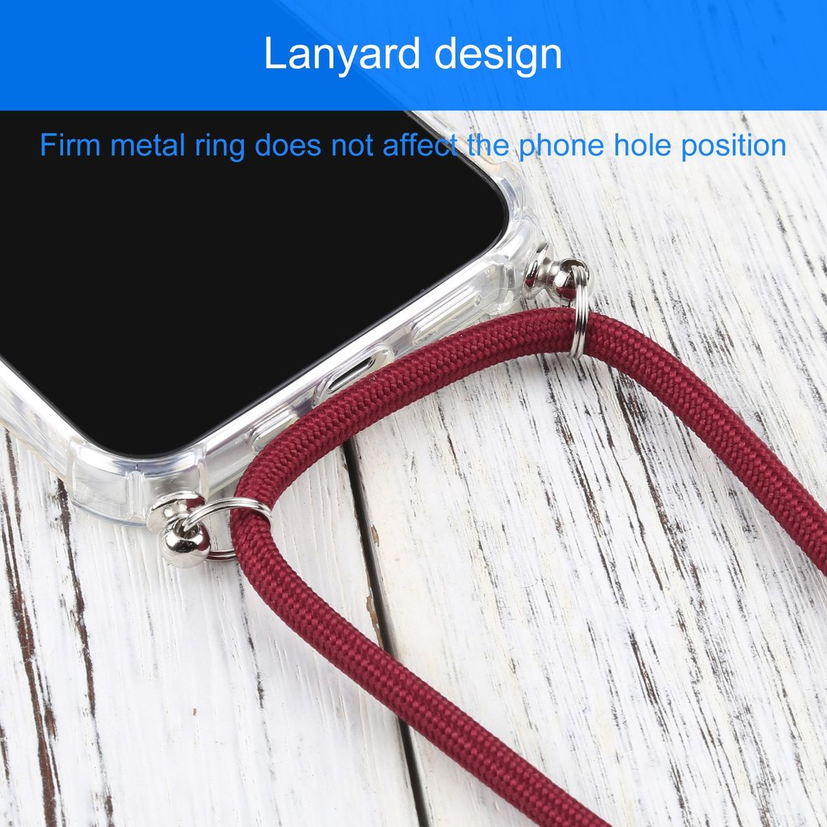 Telefon mit rotem Umhängeband, Metallring. Umhängeband-Design auf Holzoberfläche.