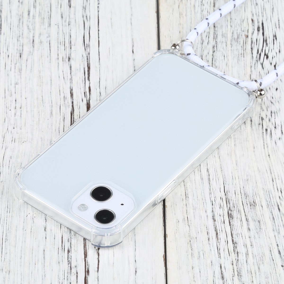 Eine transparente Handyhülle mit einem weißen und grauen Lanyard. Das Telefon liegt mit der Vorderseite nach oben.