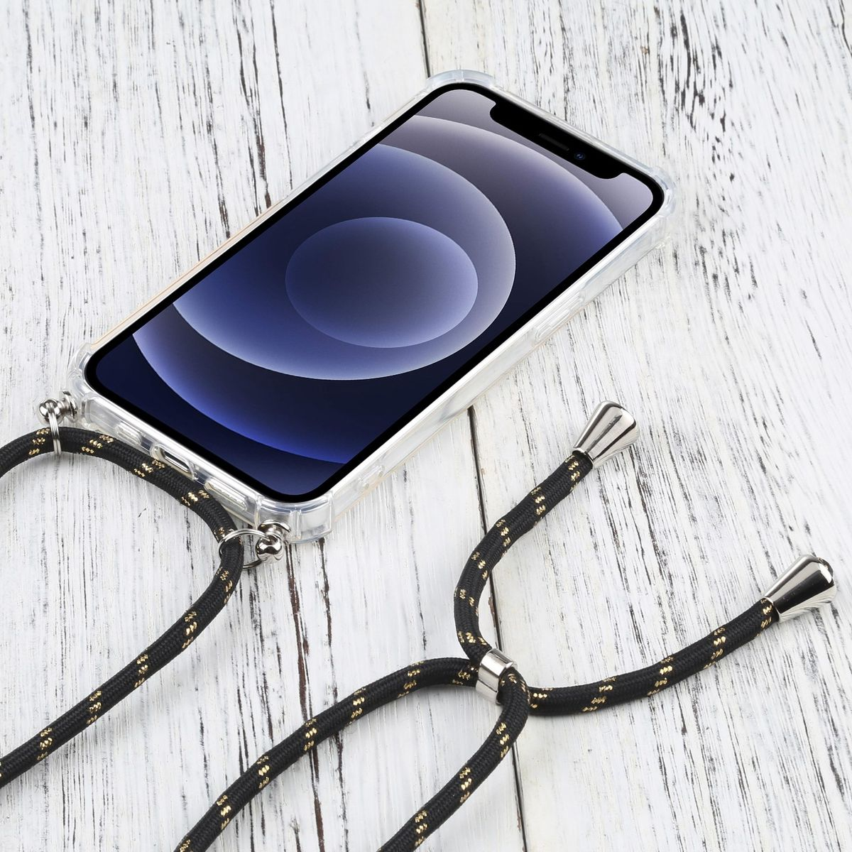 Telefon mit klarer Hülle und schwarzem und goldenem Seil. Das Telefon liegt auf Holz.