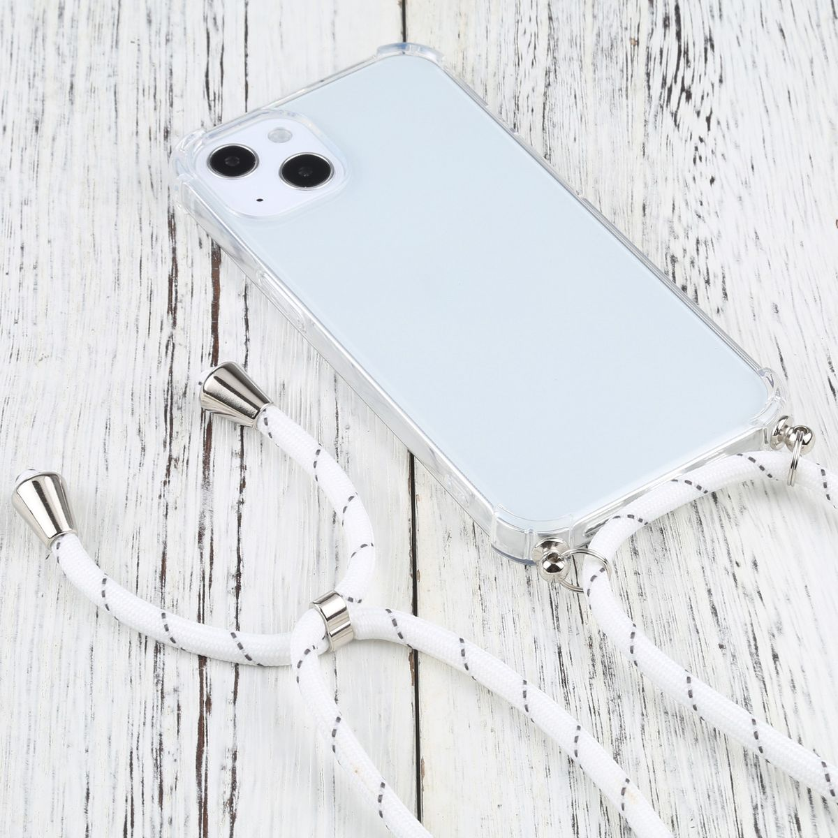 Weißes Telefon mit einer durchsichtigen Hülle und einem weißen Kabel. Die Hülle hat eine transparente Rückseite.