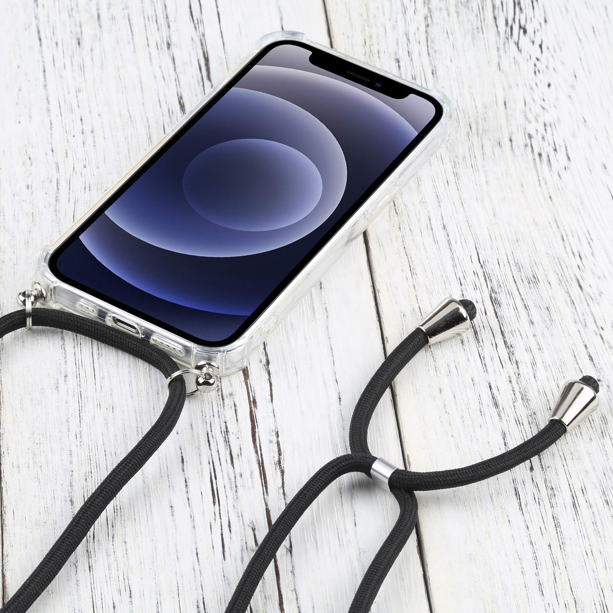 Transparente Handyhülle mit schwarzem Kabel. Das Handy liegt auf weißem Holz.