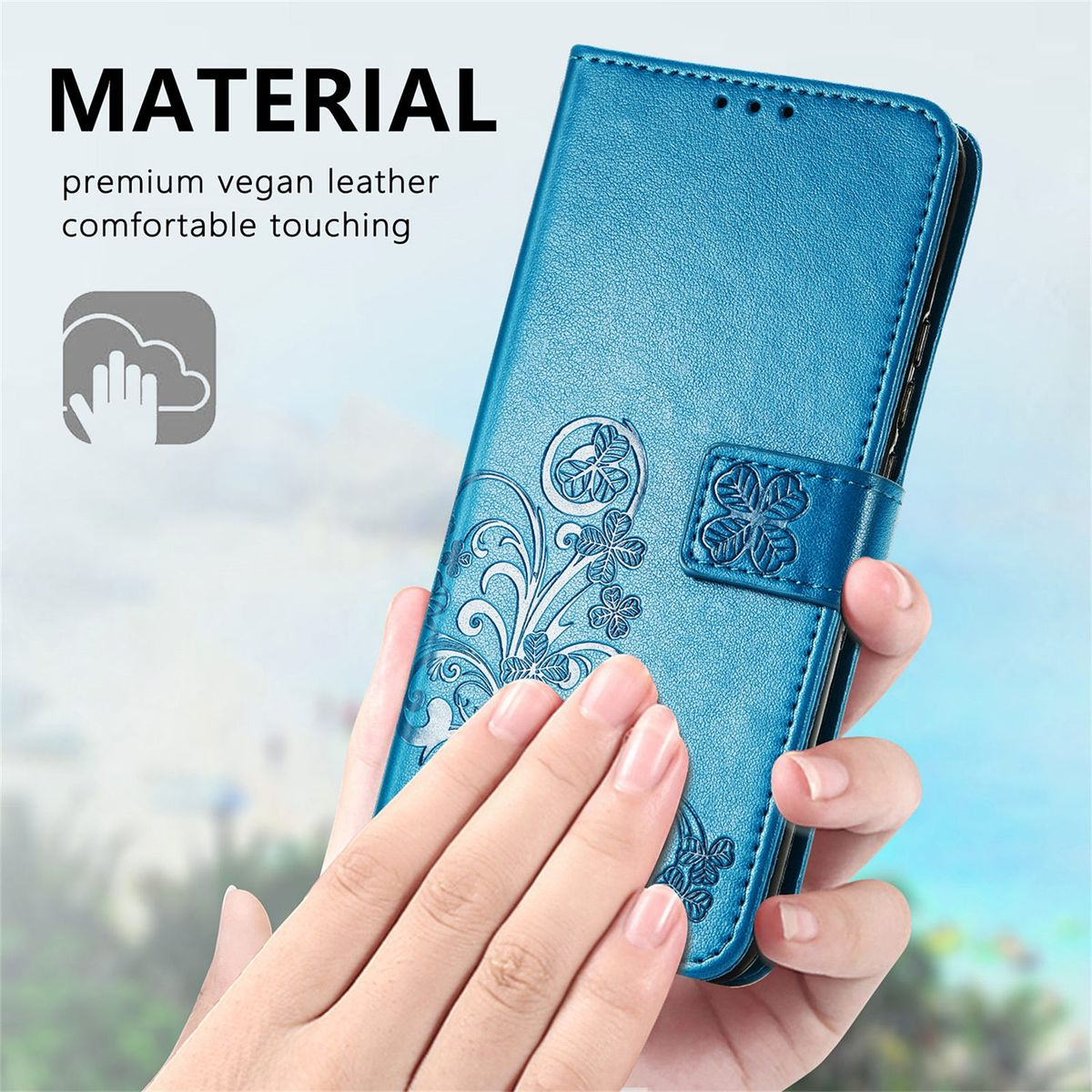 Blaue Handyhülle mit floralem Design, Hand berührt sie.