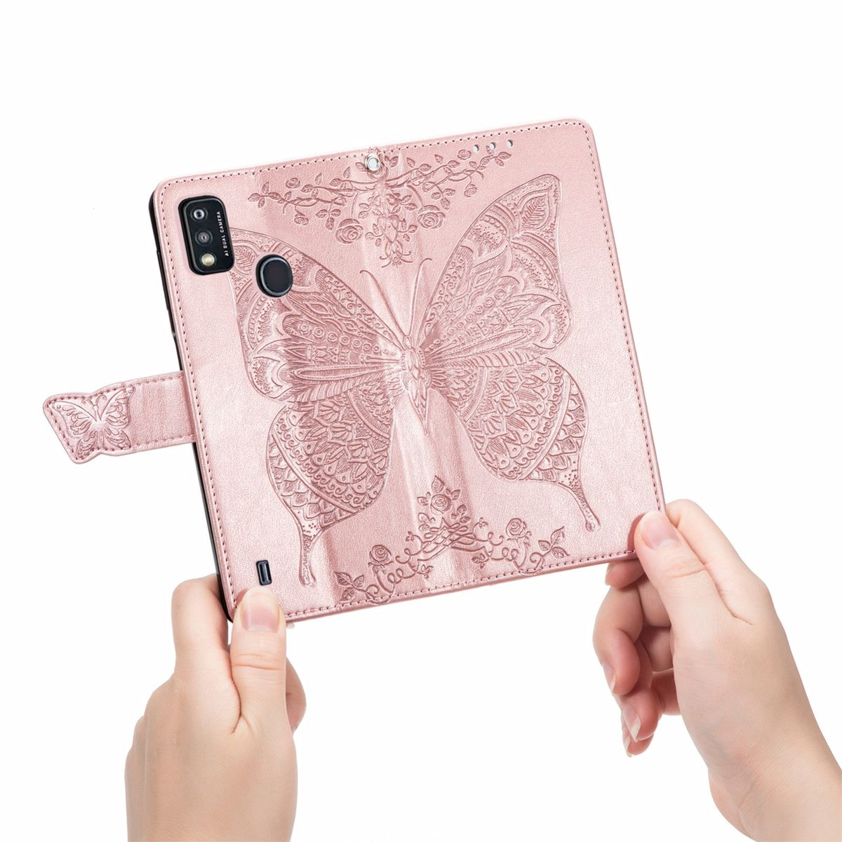 Rosa Handyhülle mit geprägtem Schmetterlingsdesign, gehalten von Händen.
