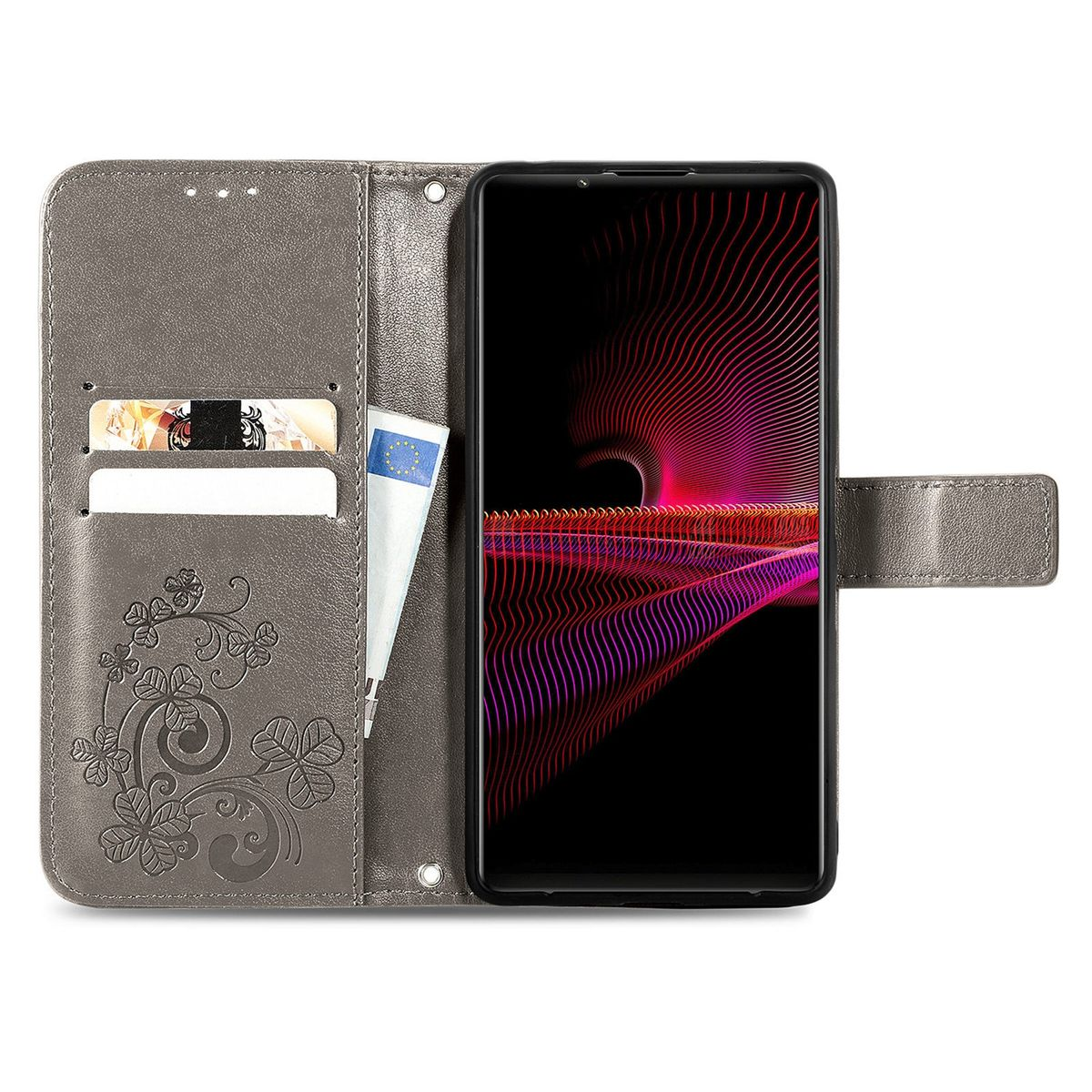 Graue Handyhülle, offen, mit Telefon und Kartenfächern. Geprägtes Design auf der Hülle. Helle Oberfläche.