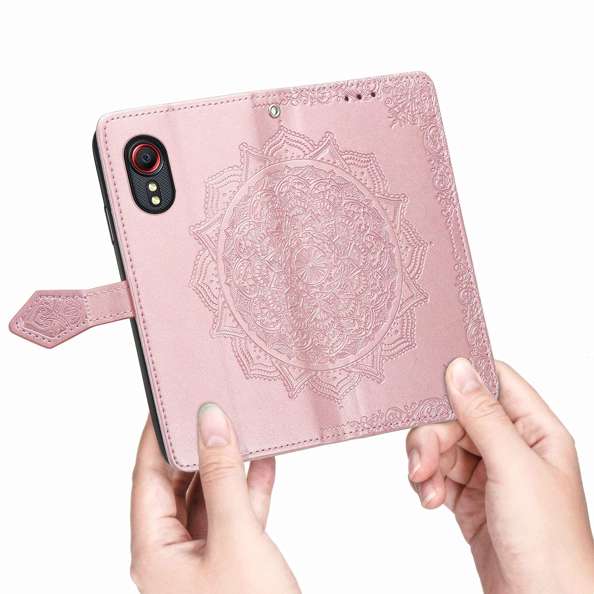 Rosa Handyhülle mit floralem Design. Die Handyhülle ist offen und auf einer weißen Oberfläche.