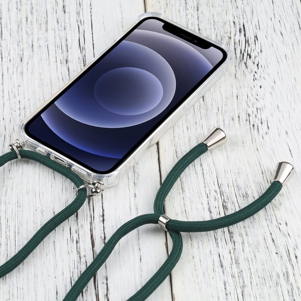 Telefon mit grünem Band. Der Hintergrund ist eine weiße Holzoberfläche.