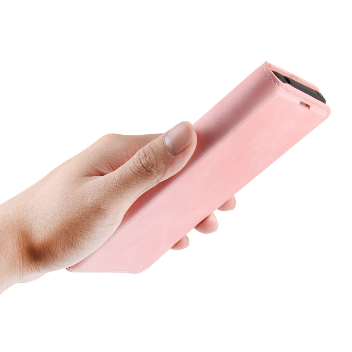 Eine Hand hält eine rosa Handyhülle. Der Koffer ist rechteckig und geschlossen.