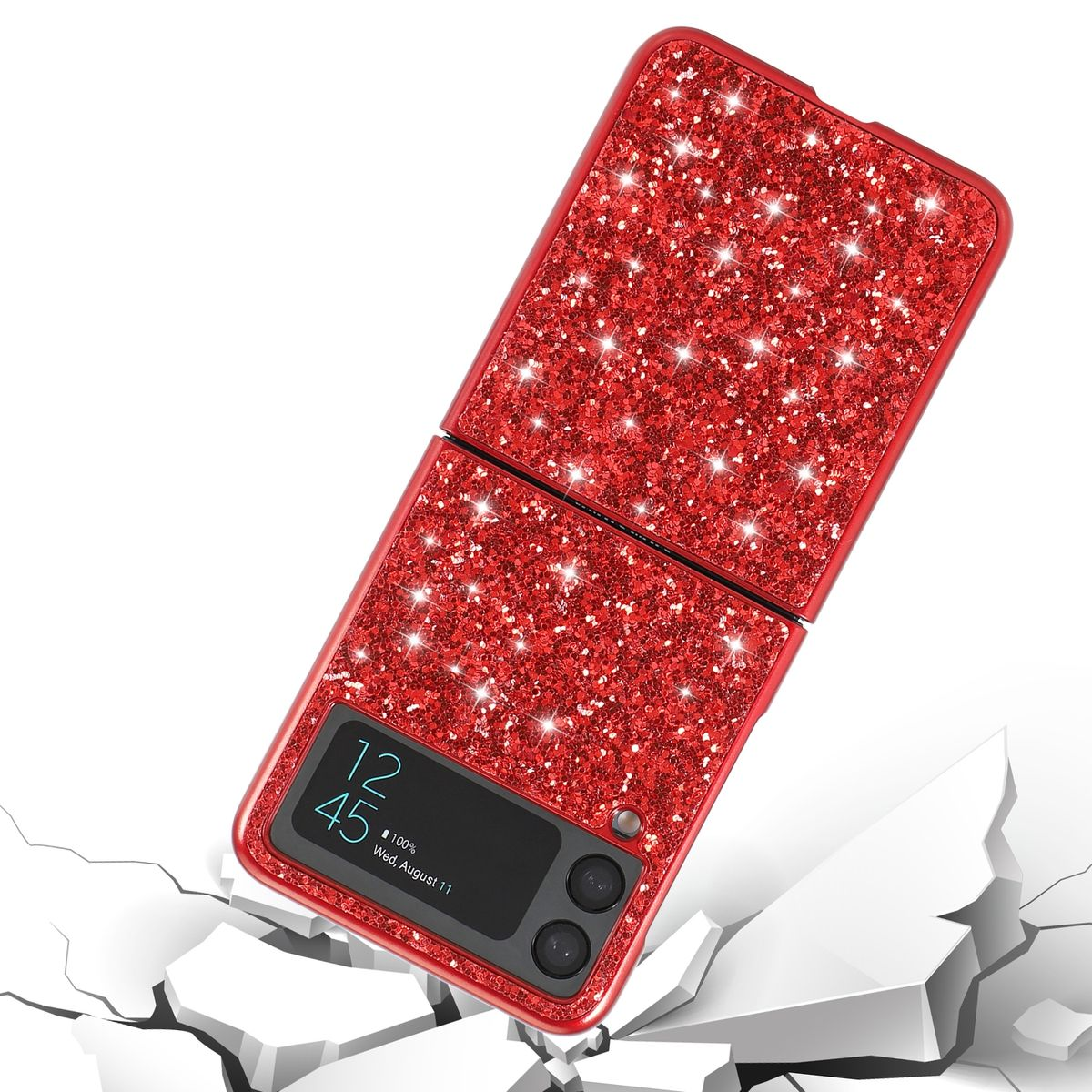 Rote Glitzer-Handyhülle mit einem Telefon darin. Das Telefon ist geöffnet und liegt auf einer zerbrochenen Oberfläche.