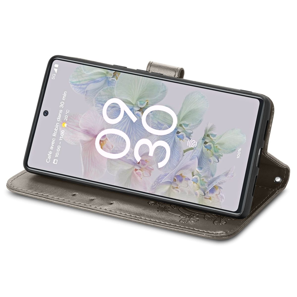 Graue Handyhülle mit Telefon, als Ständer genutzt. Der Bildschirm zeigt Zeit und Datum.