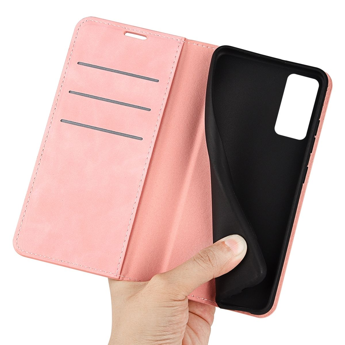 Eine Hand, die eine offene rosa Handyhülle mit schwarzer Innenseite und einem handförmigen Ausschnitt hält.