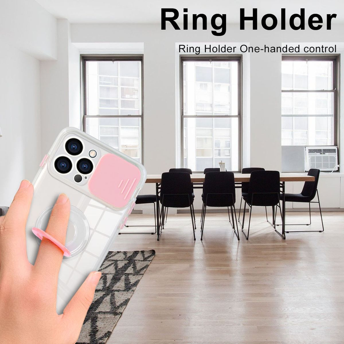 Eine Hand, die ein Telefon mit einem Ringhalter hält. Ringhalter ist rosa. Hintergrund ist ein Wohnzimmer.