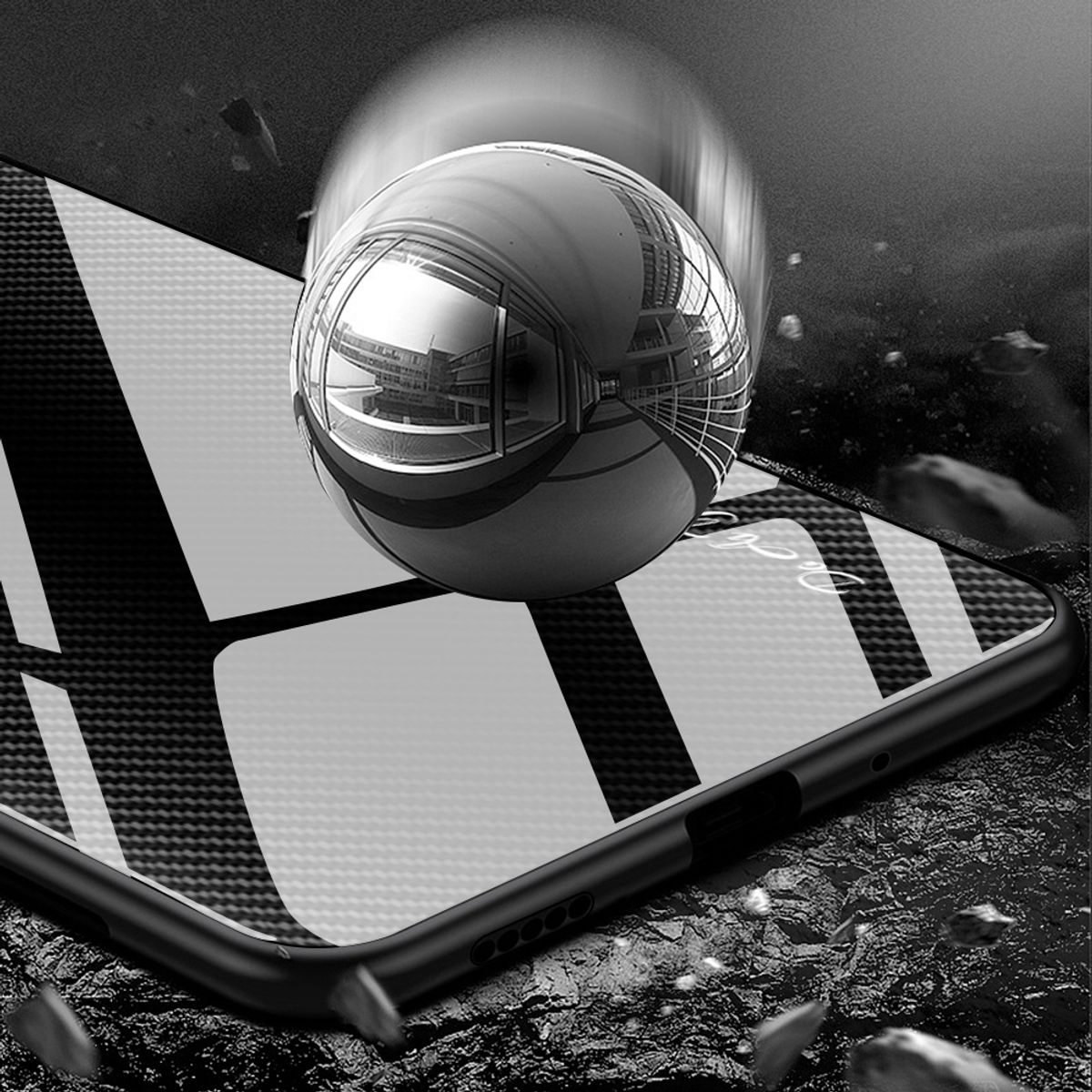 Schwarzes Telefon, Glasscheibe, mit fallendem Ball, der Gebäude reflektiert. Schwarzer Hintergrund.