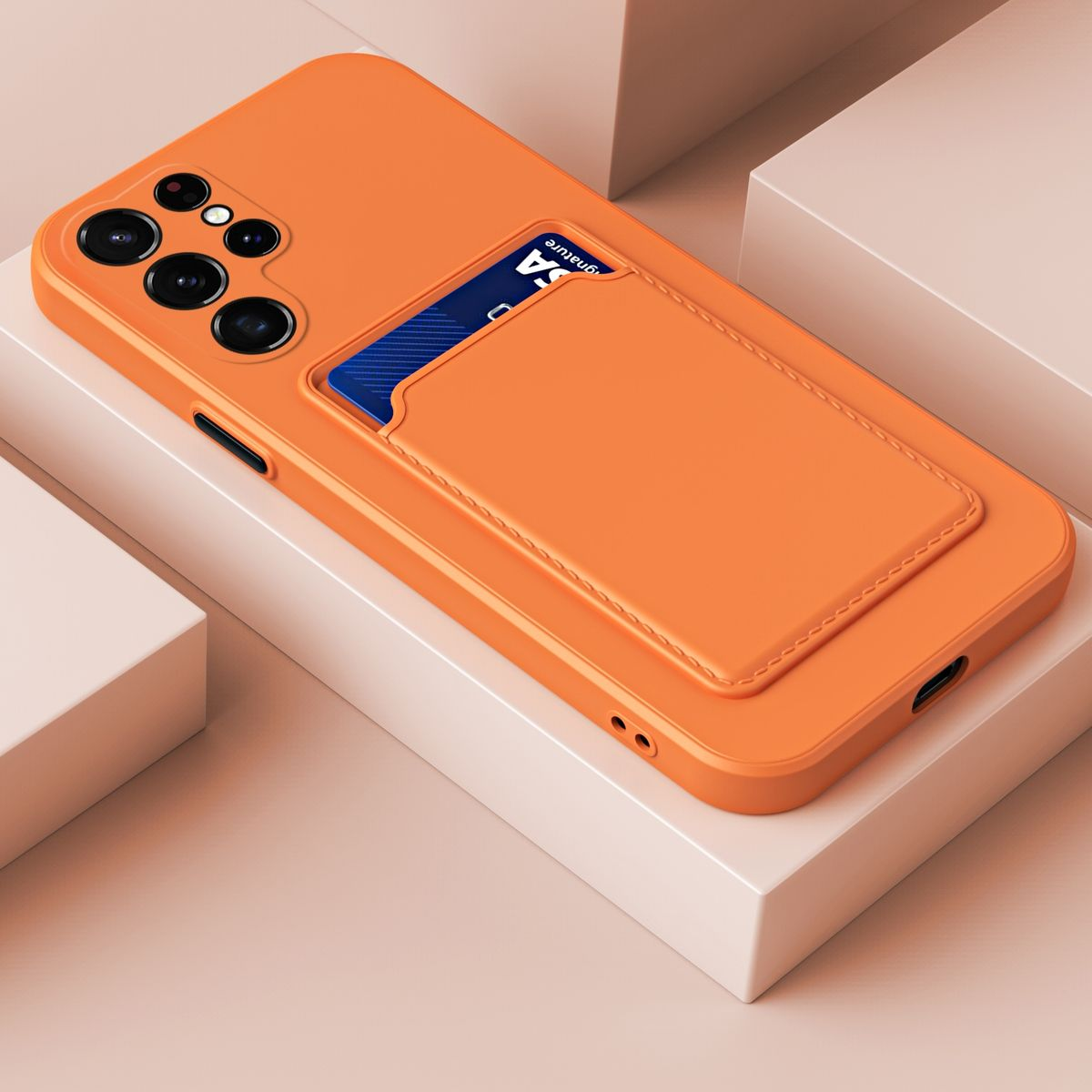 Orangefarbene Handyhülle mit Kartenhalter. Das Case liegt auf einer weißen Oberfläche.