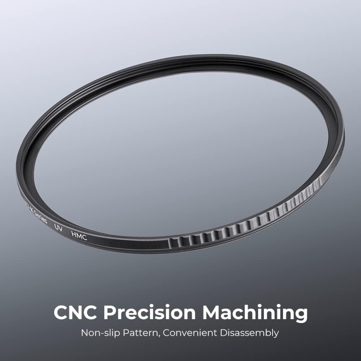 Circular lens filter with black frame. The text 'UV HMC' is on the frame. The surface is reflective.