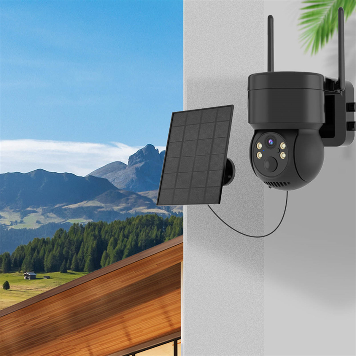 Schwarze Überwachungskamera an einem Gebäude, mit Solarpanel. Berge und Himmel im Hintergrund.