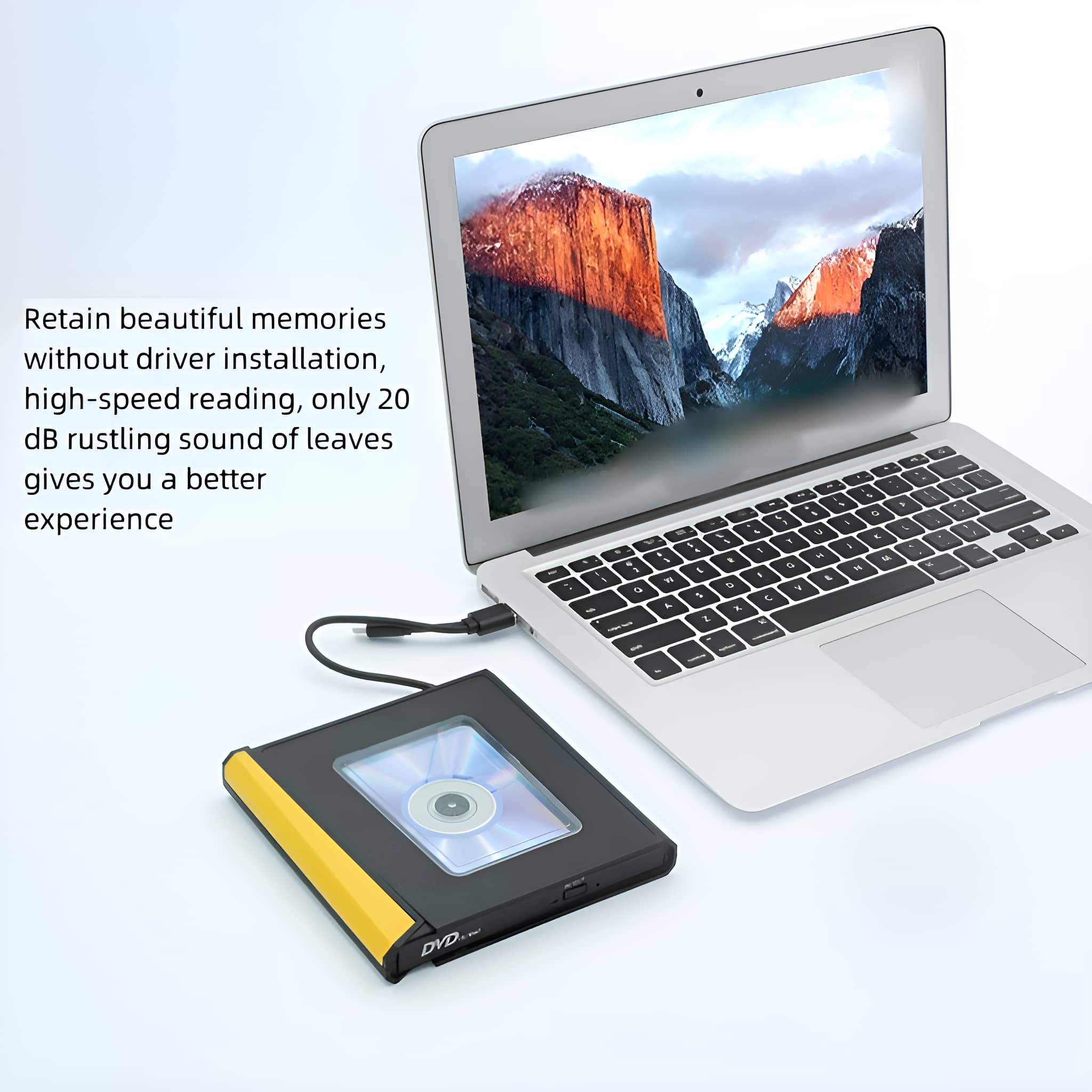 Laptop neben einem DVD-Laufwerk. Der Bildschirm zeigt eine Landschaft. Text links.