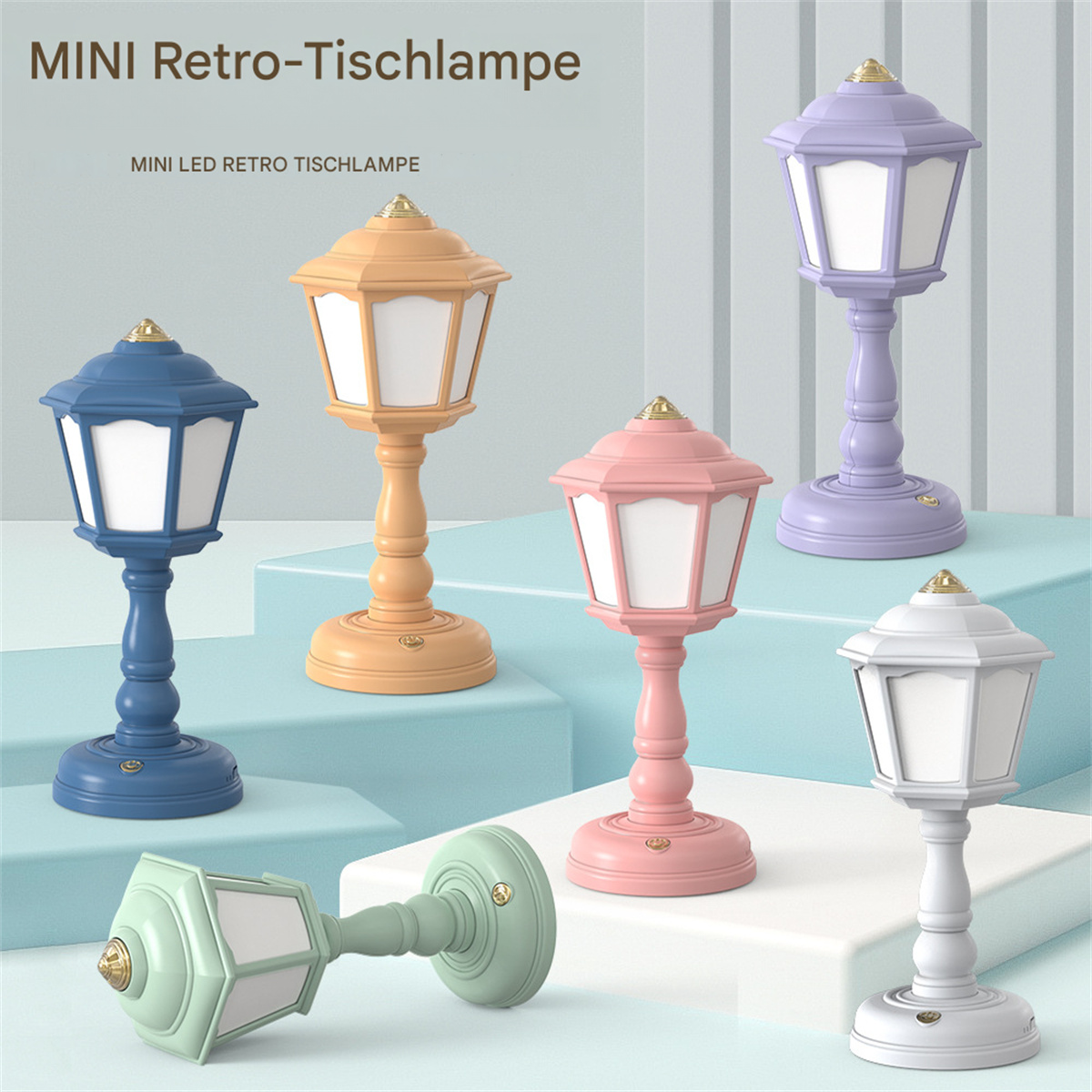 Bunte Mini-Retro-Lampen in verschiedenen Farben: blau, orange, rosa, lila und weiß. Alle eingeschaltet.