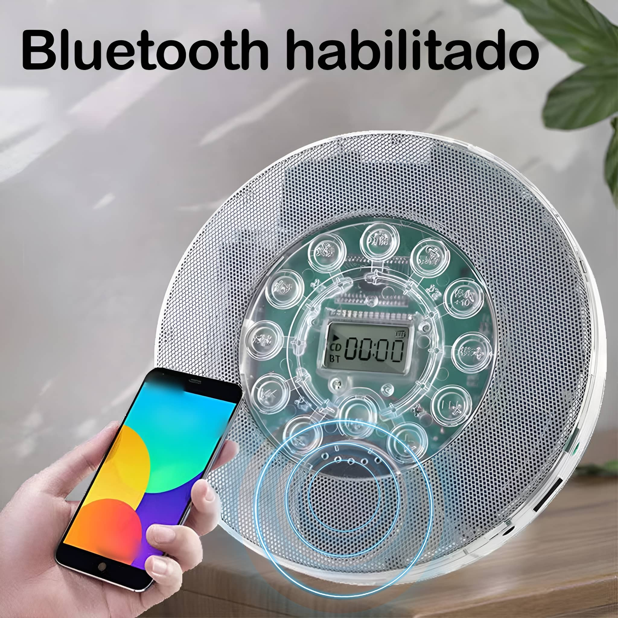 Eine Hand hält ein Telefon neben einem Bluetooth-fähigen Musikplayer.