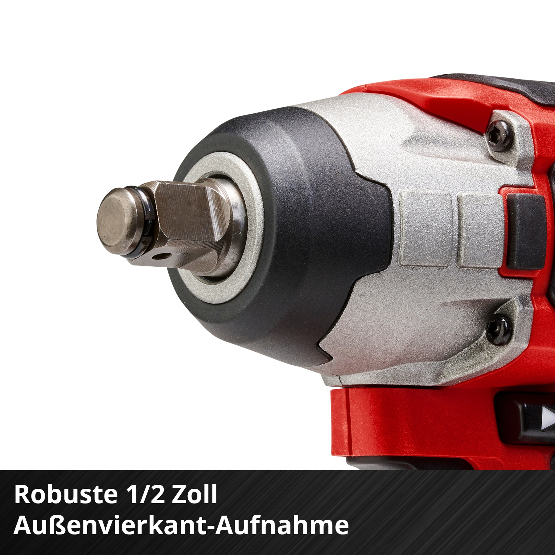 Zbliżenie czerwonego i srebrnego klucza udarowego, ostrość na głowicy.