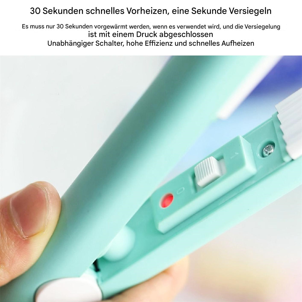 Nahaufnahme eines türkisgrünen Handgeräts mit Schalter und rotem Licht.