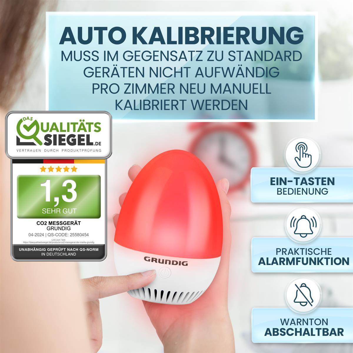 Ein rot-weißer Luftqualitätsmonitor. Es hat ein Produktetikett und mehrere Informationssymbole.