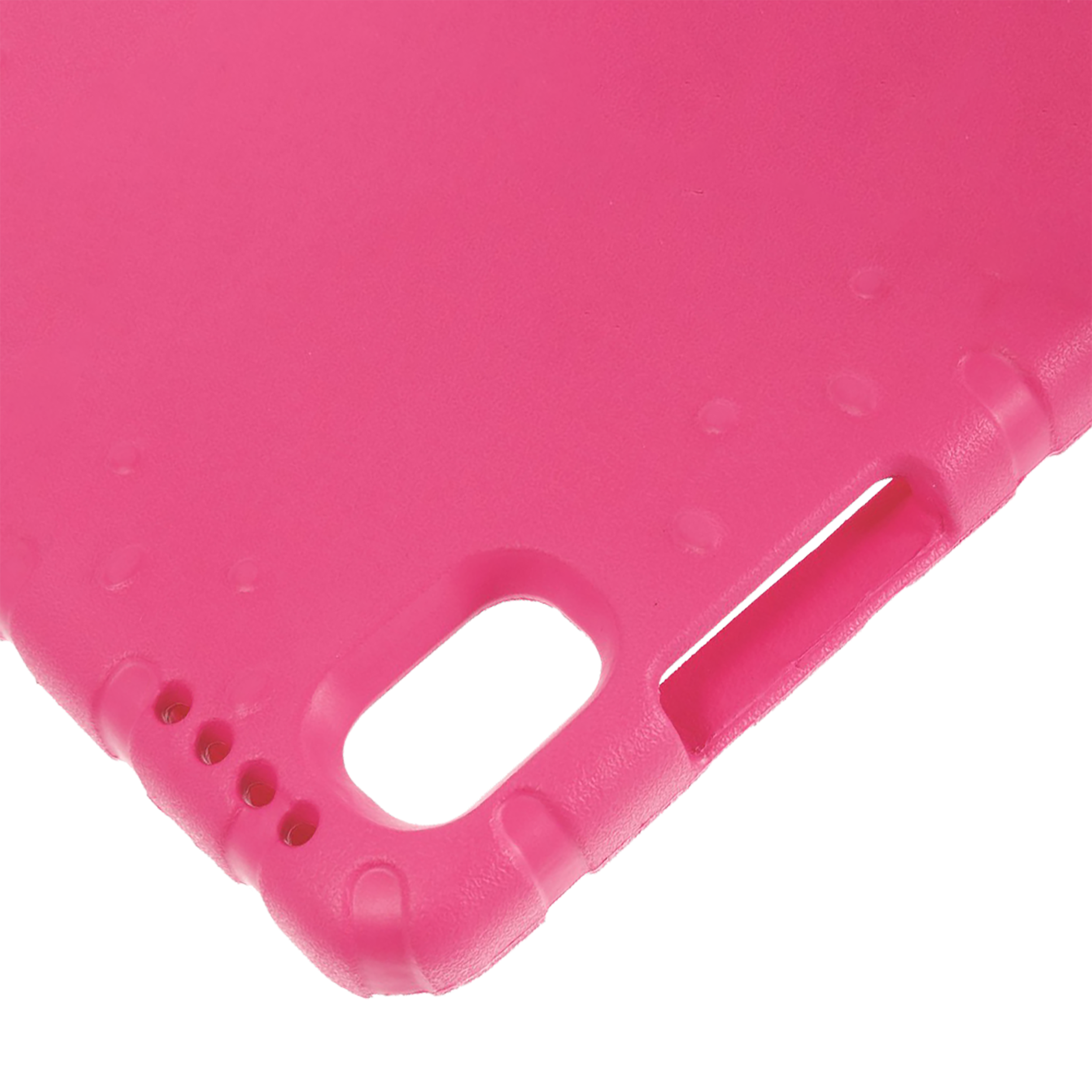 Nahaufnahme einer leuchtend rosa, strukturierten Tablettenecke. Ein Loch ist sichtbar.