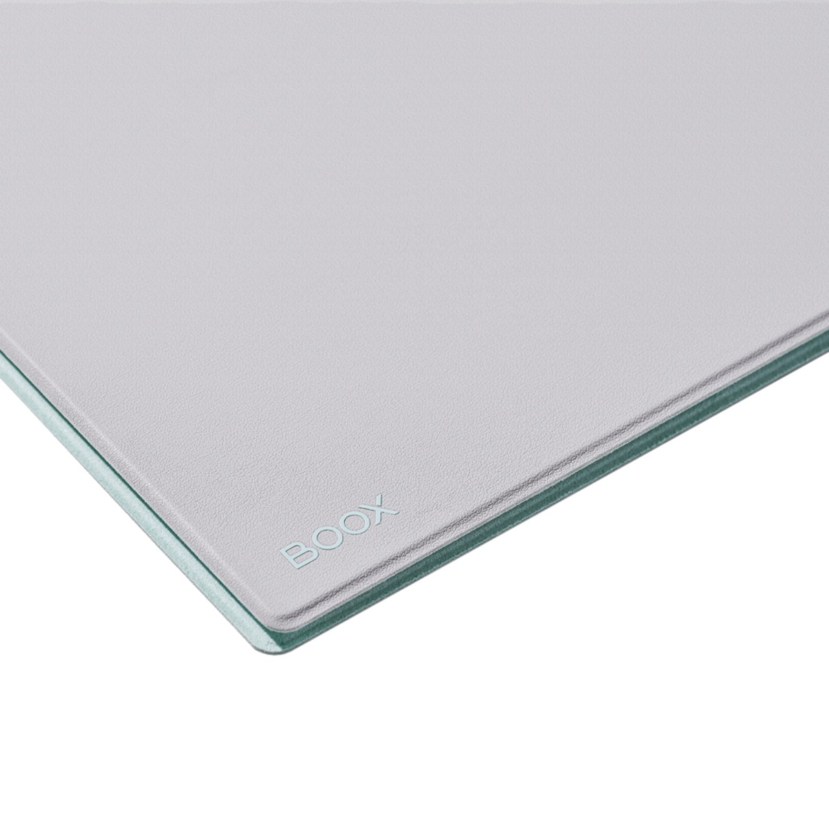 Primer plano de una almohadilla gris y transparente con la palabra 'BOOX' grabada.