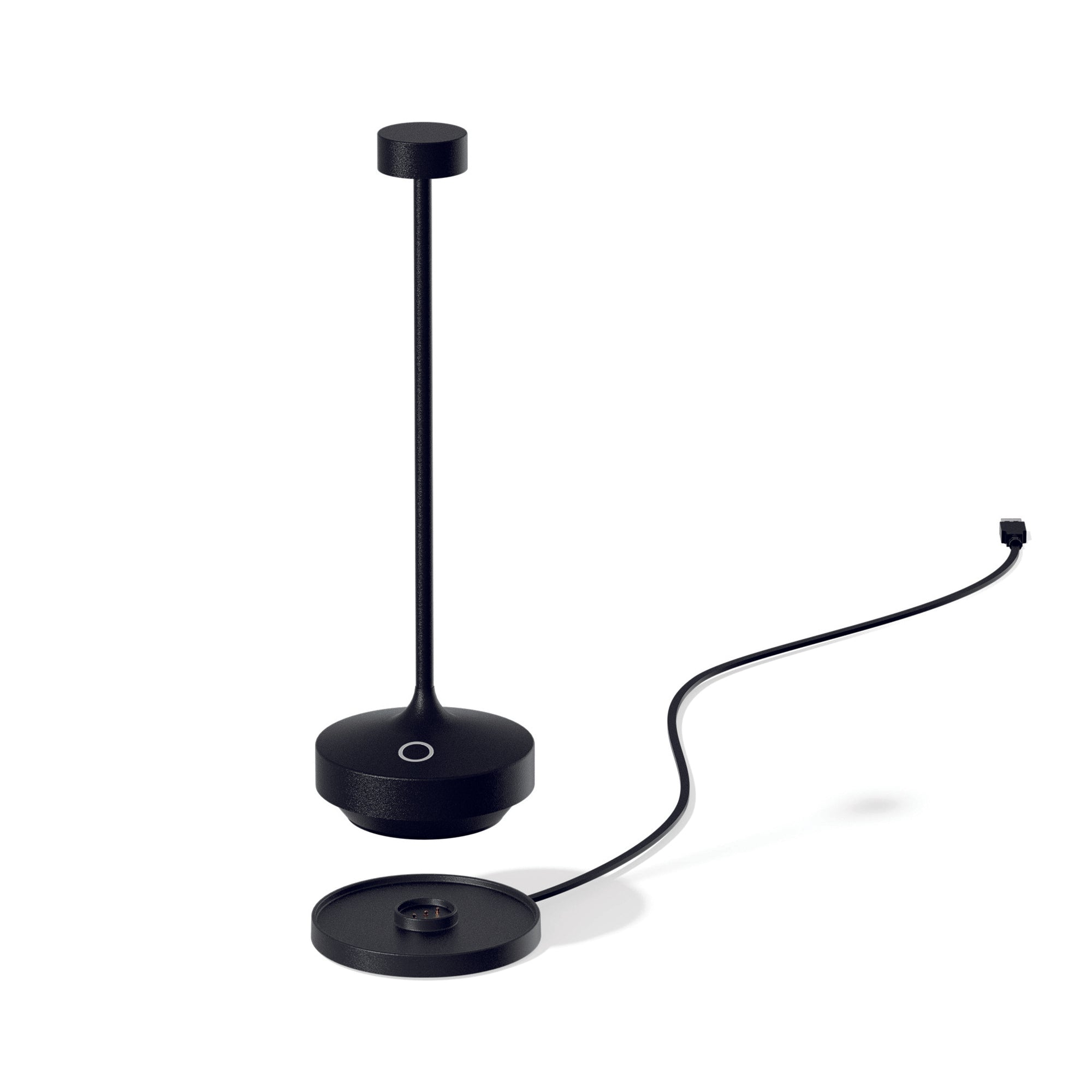 Schwarze Schreibtischlampe, zerlegt. Lampe, Sockel und Ladestation. Weißer Hintergrund.