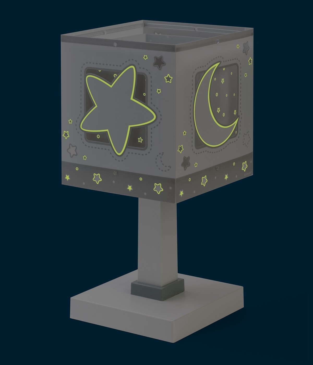 Una luz de noche gris en forma de cubo con estrellas y una luna.