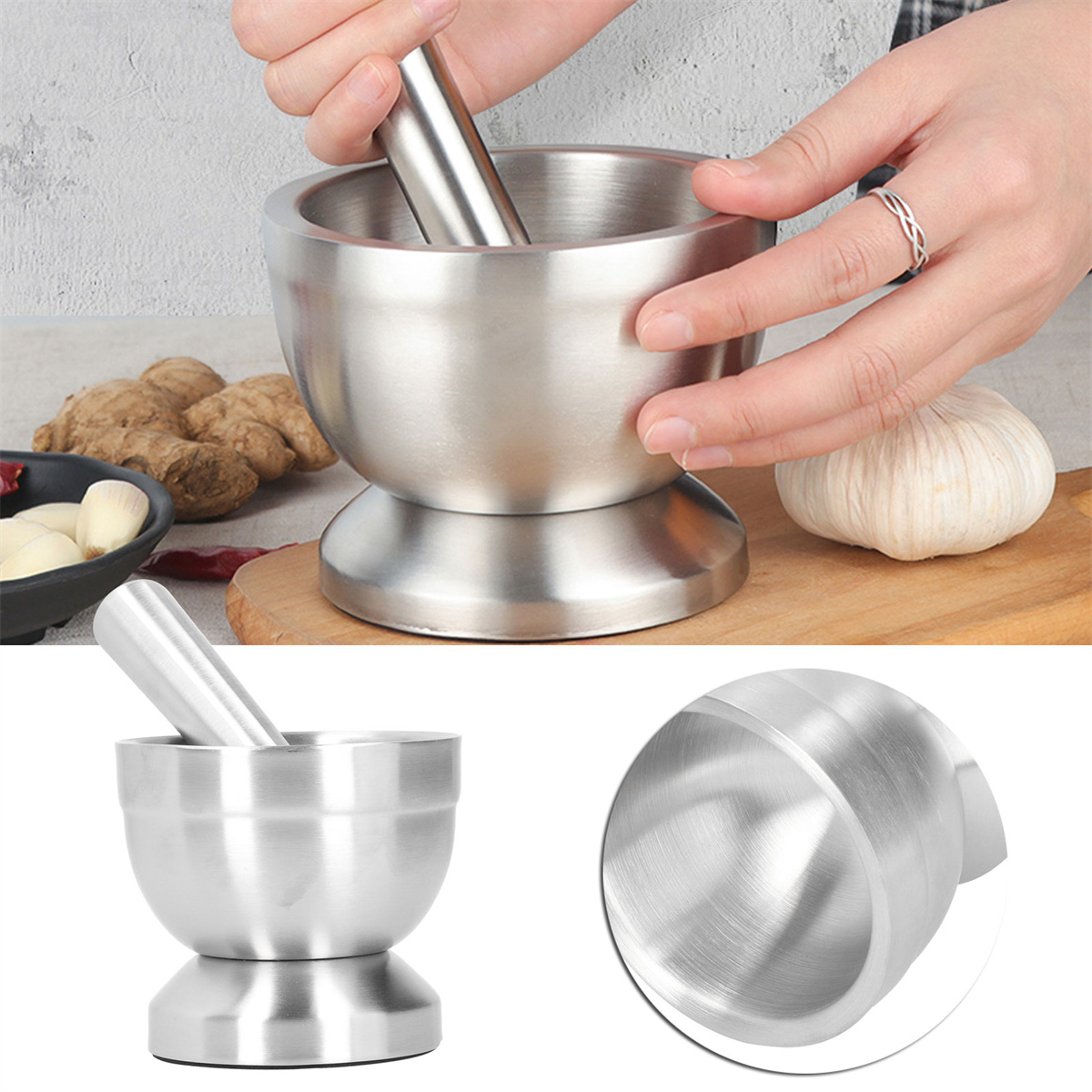 Silbernes Mörser- und Stößel-Set. Eine Hand verwendet den Stößel, um Zutaten darin zu zerdrücken.