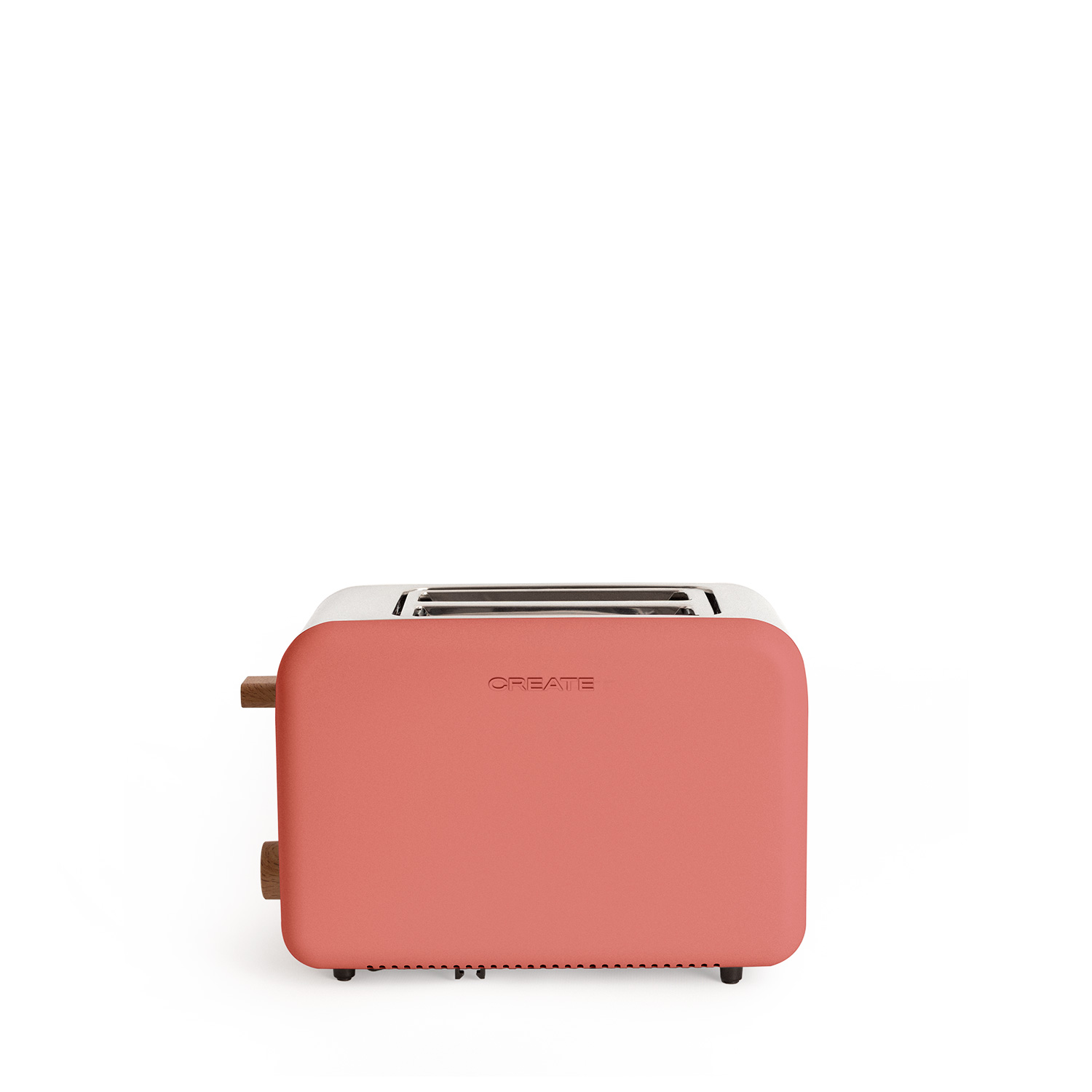 Una tostadora color coral sobre una superficie blanca con detalles de madera.