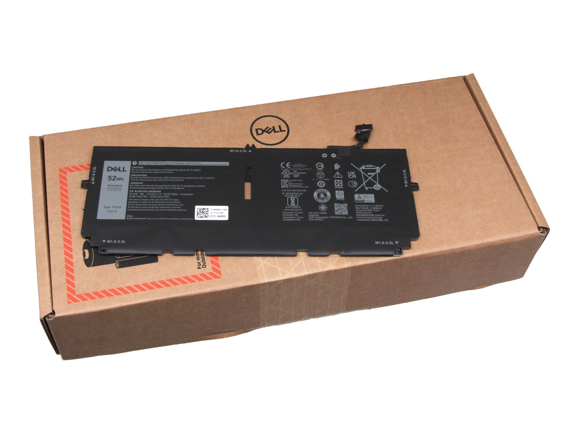 Ein Laptop-Akku in einem Karton, mit Text und Etiketten auf dem Akku.