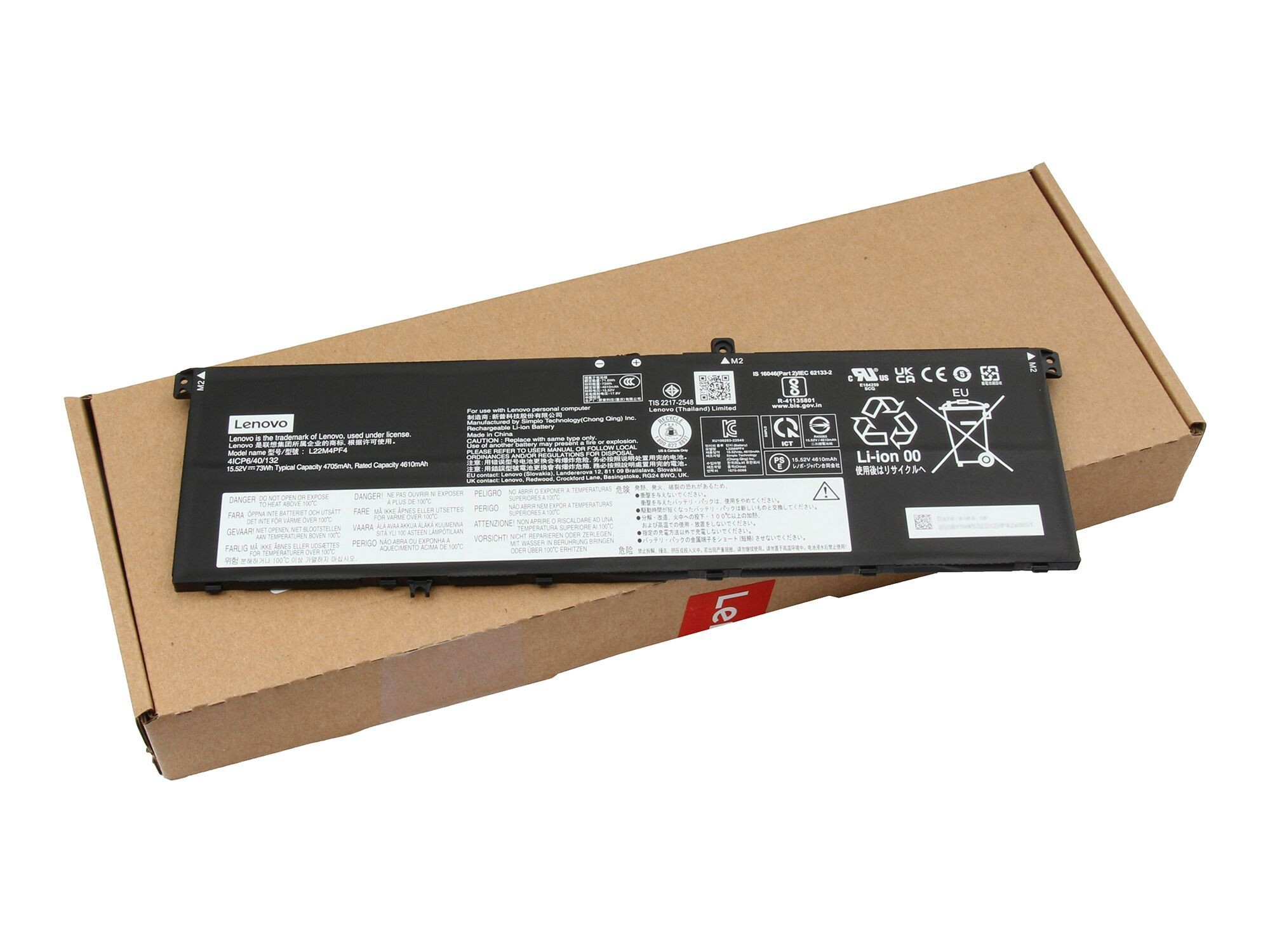 Lenovo Laptop-Akku auf Karton. Beschriftet mit Details und Warnungen. Weißer Hintergrund.