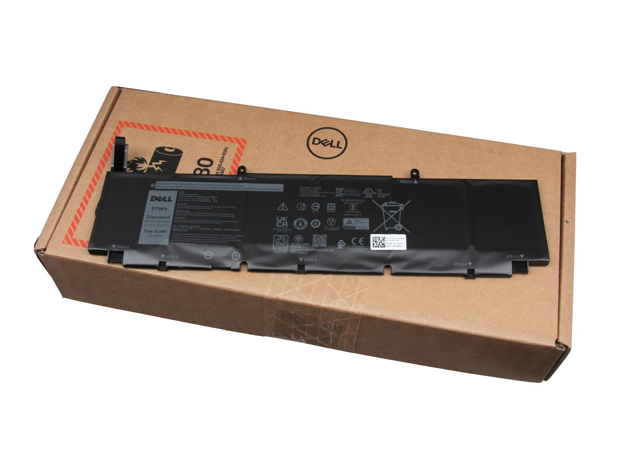Dell Laptop-Akku. Schwarz und rechteckig, mit Etiketten. Auf einem Karton platziert.