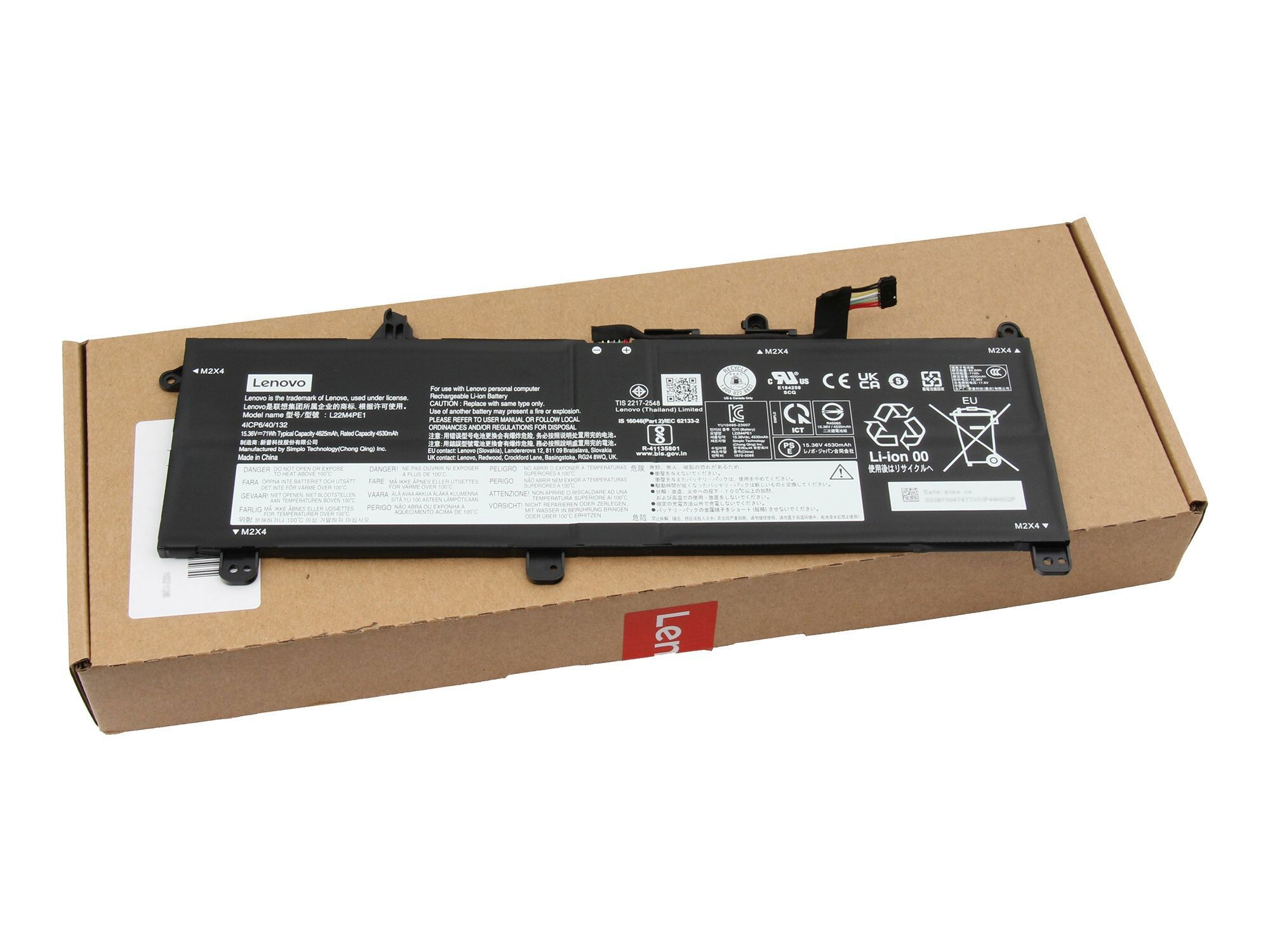 Laptop-Akku in einem Karton, mit Lenovo- und Warnhinweisen sichtbar.