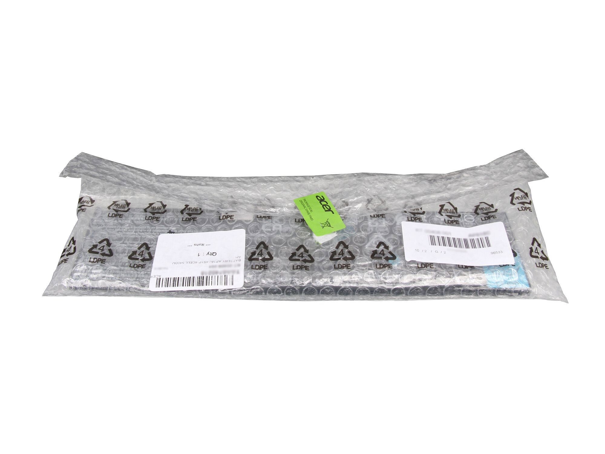Laptop-Tastatur in Luftpolsterfolie verpackt. Aufkleber und Etiketten sichtbar.