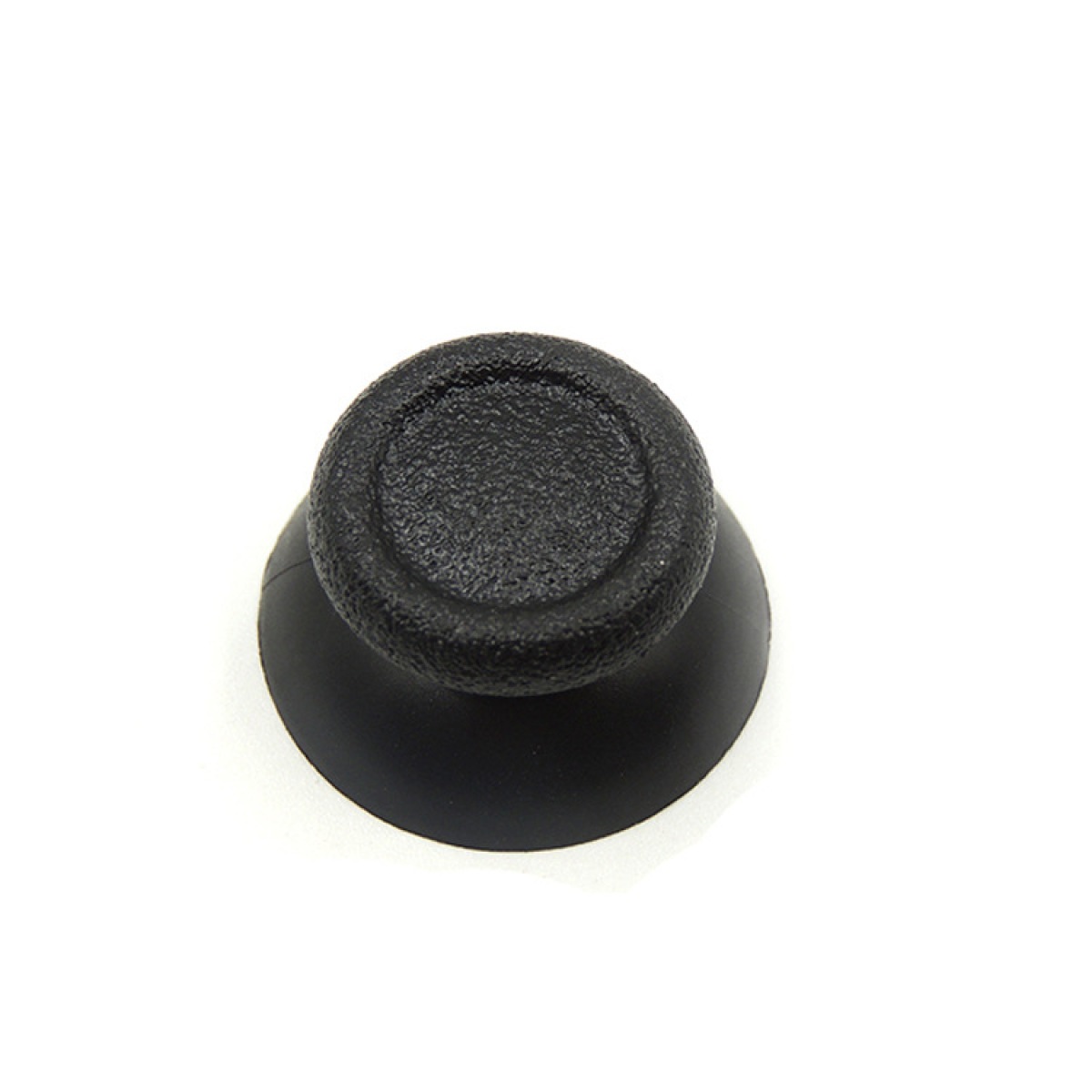 Black joystick thumbstick with a textured surface, isolated on white background.