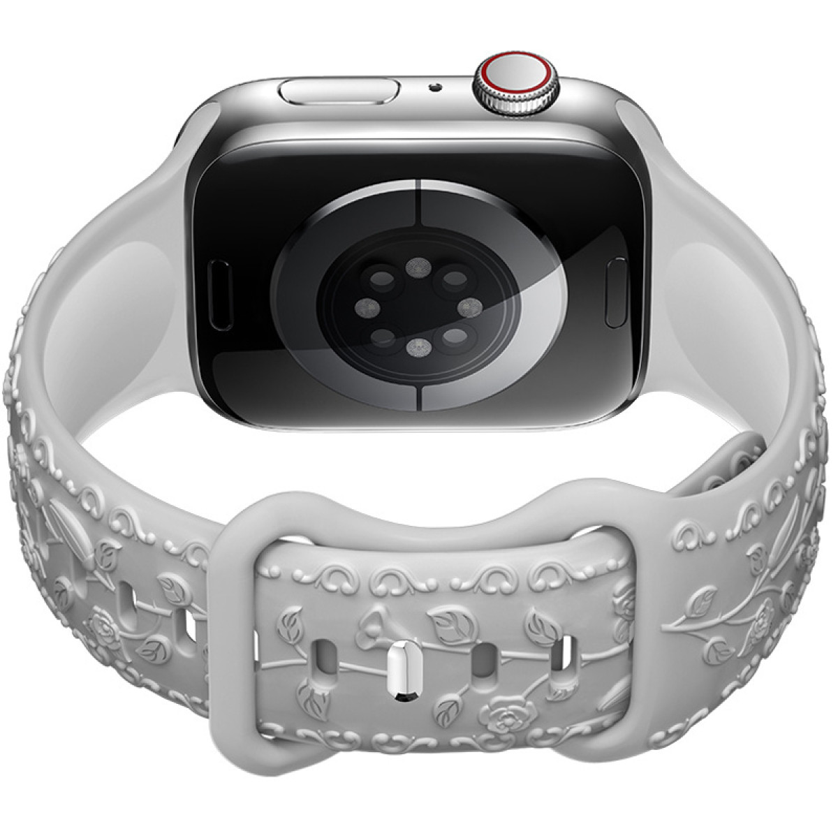 Srebrny Apple Watch z białym paskiem w kwiaty. Tył zegarka z czujnikiem i czerwoną koronką.