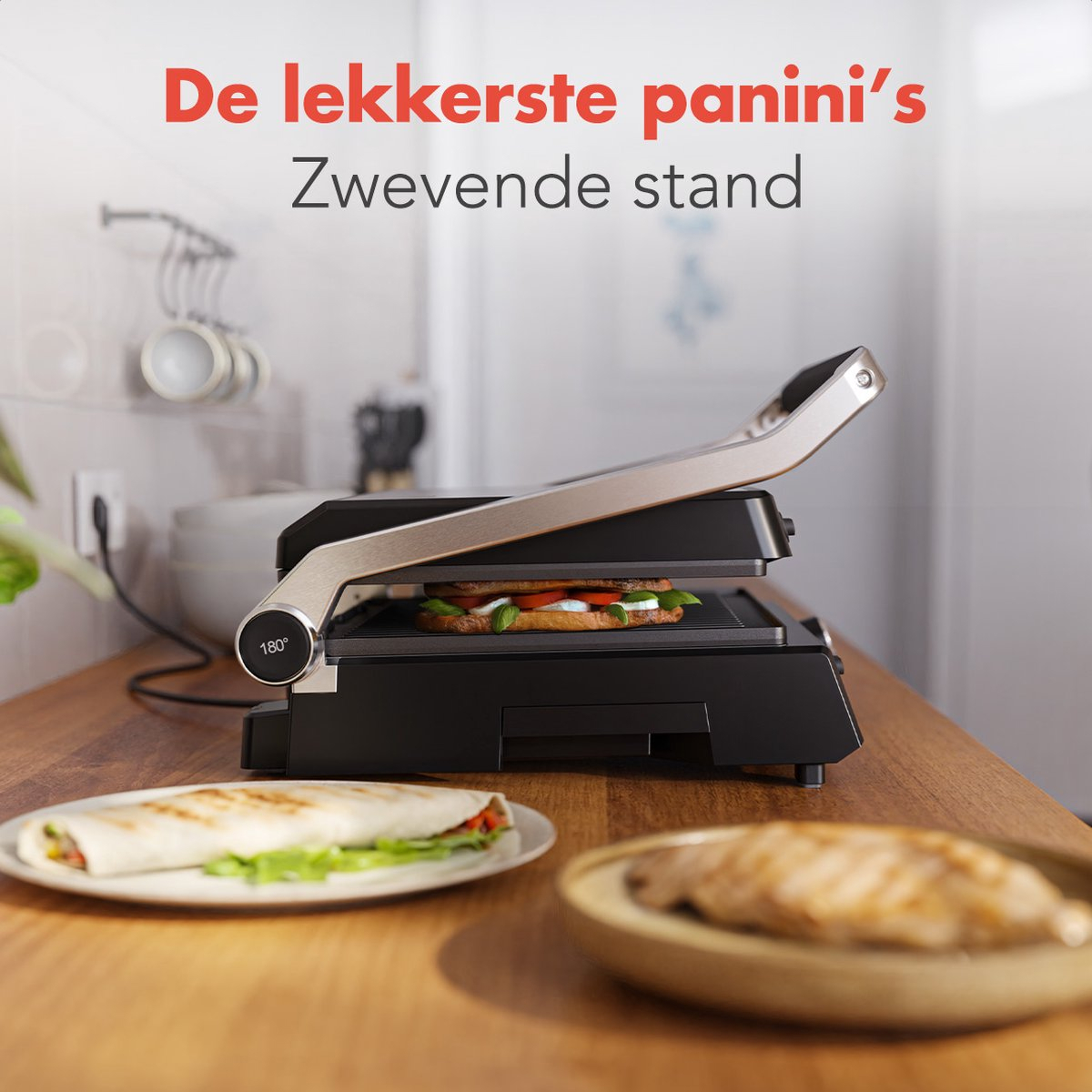 Grill with sandwich, plate with food. Text: The tastiest panini's, Floating stand.