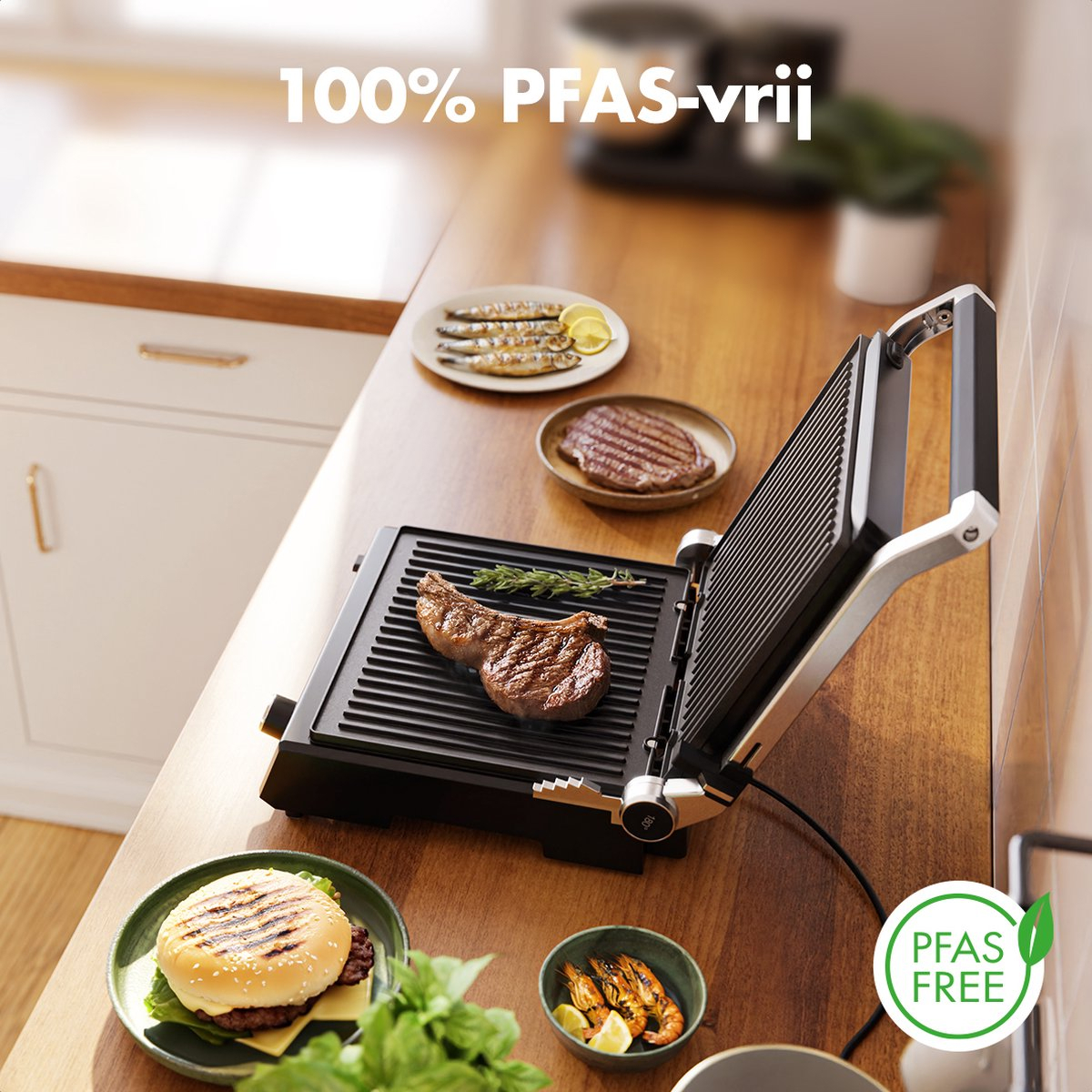 A grill with food on it, along with other plates of food and text: 100% PFAS-free.