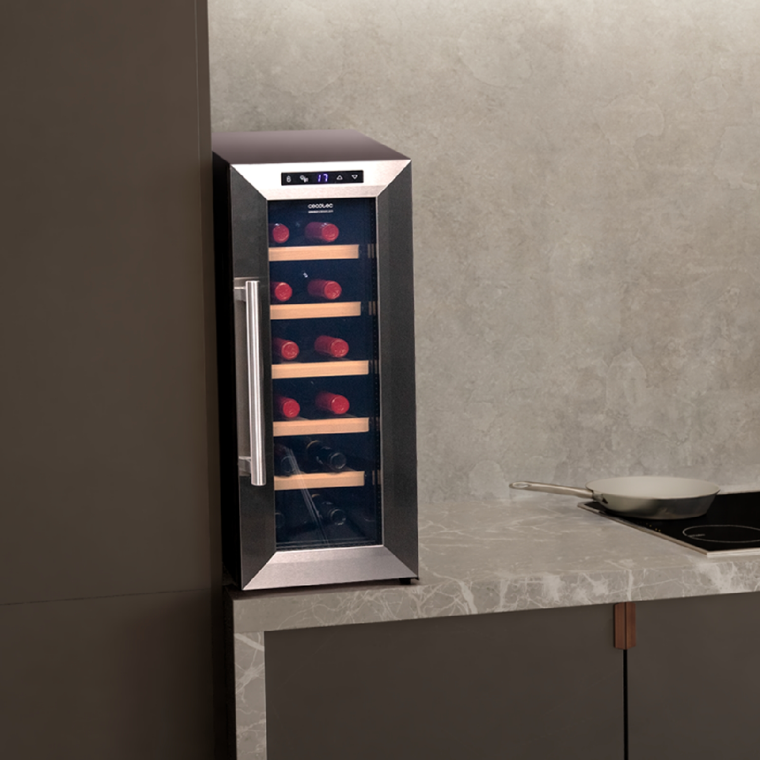 Wine cooler on a countertop. It is a dark gray color with glass door.