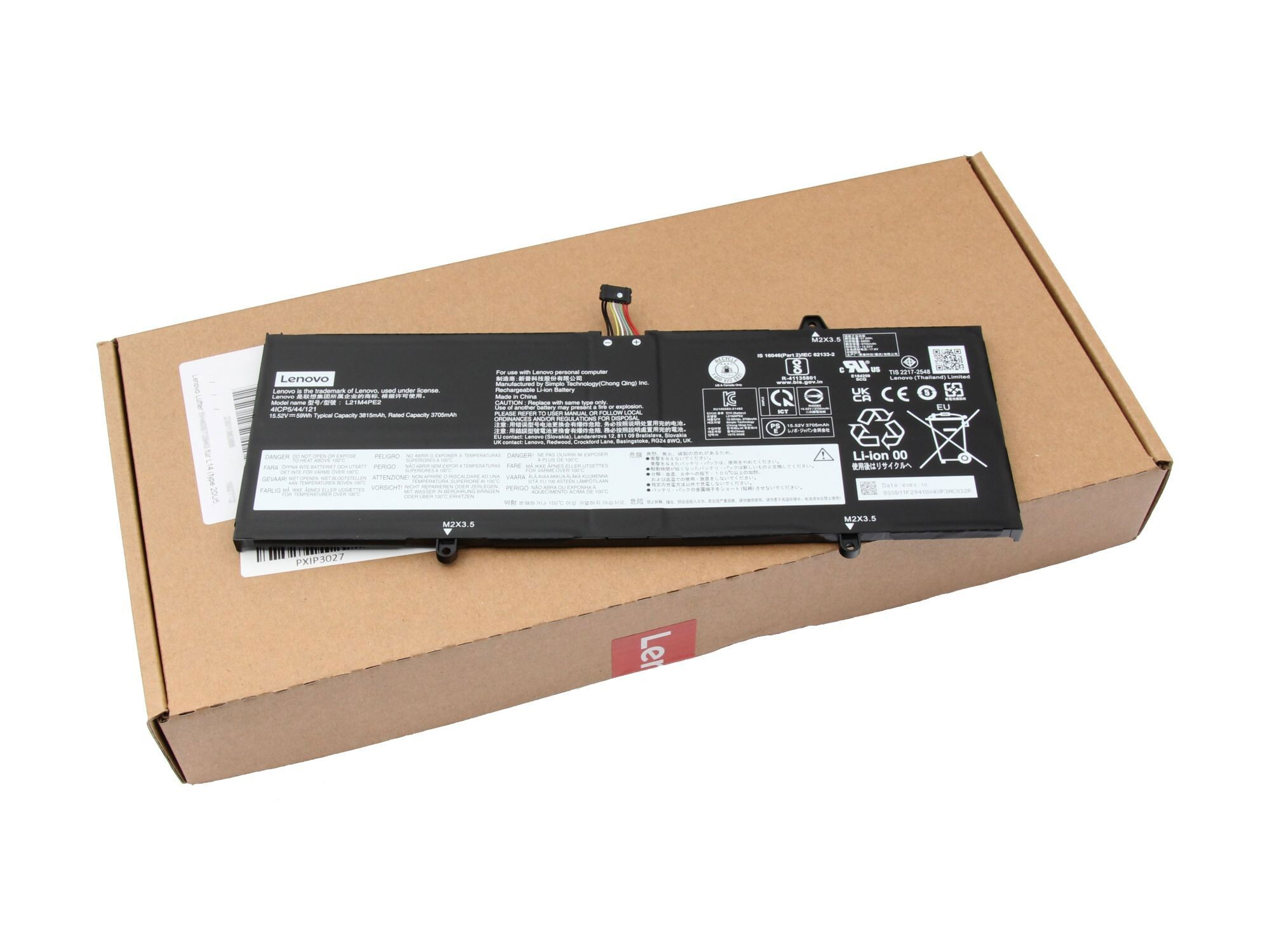 Laptop-Akku und Lenovo-Box mit Etiketten.