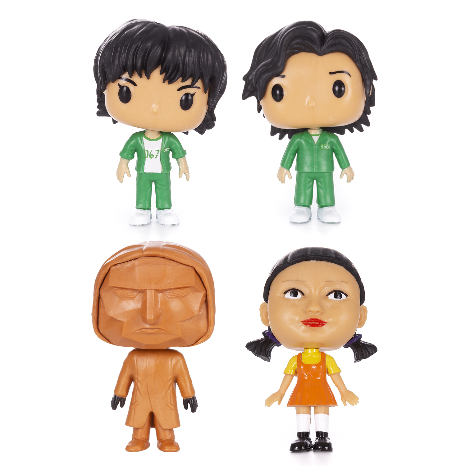 Quattro personaggi Funko Pop di Squid Game su sfondo bianco.