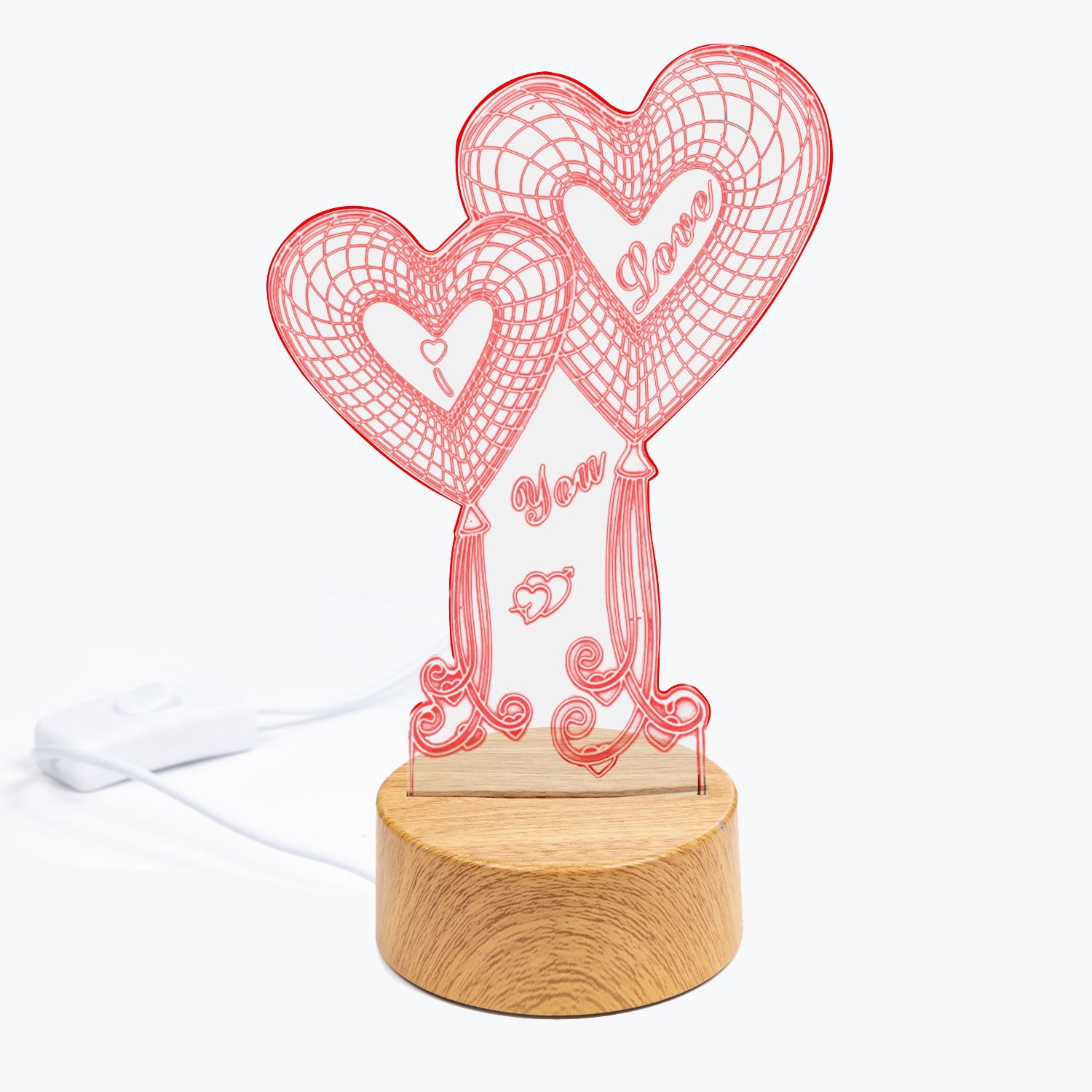 Luz LED roja en forma de corazón con texto "Love You" sobre base de madera. Cable y interruptor blancos.