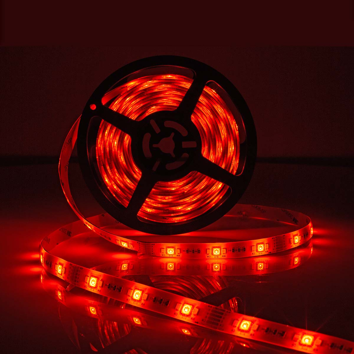 A spool of red LED strip lights emitting red light.