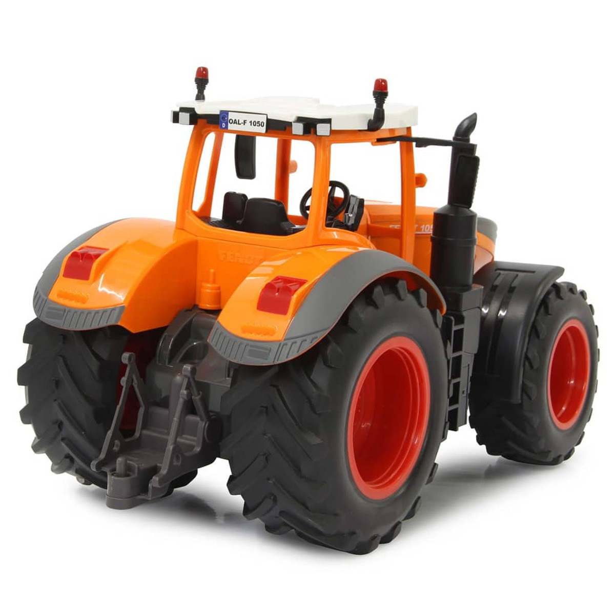 Ein orangefarbenes Traktorspielzeug. Es hat schwarze Räder mit roten Felgen, ein weißes Dach und ein schwarzes Auspuffrohr.
