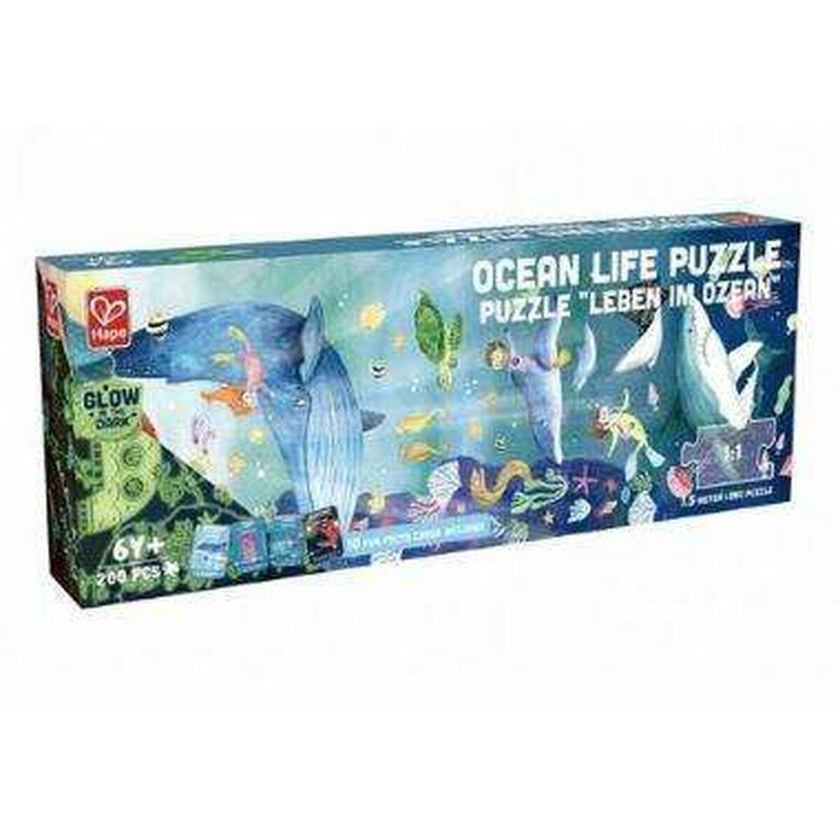 Eine Puzzledose mit einer Meereslebenszene, die Wale, Meereslebewesen und das Wort Ozean zeigt.