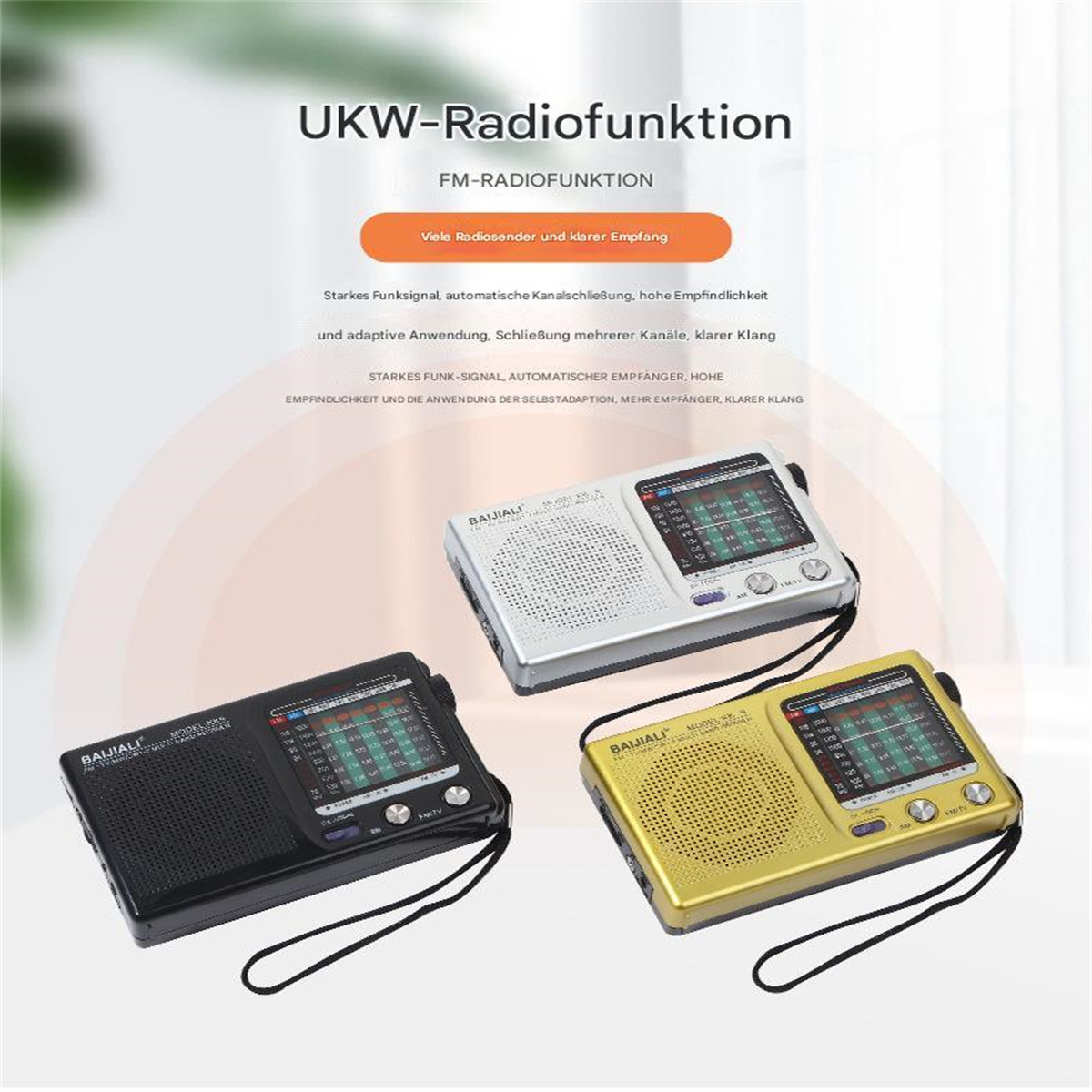 Drei Radios in Schwarz, Silber und Gold mit schwarzem Riemen.